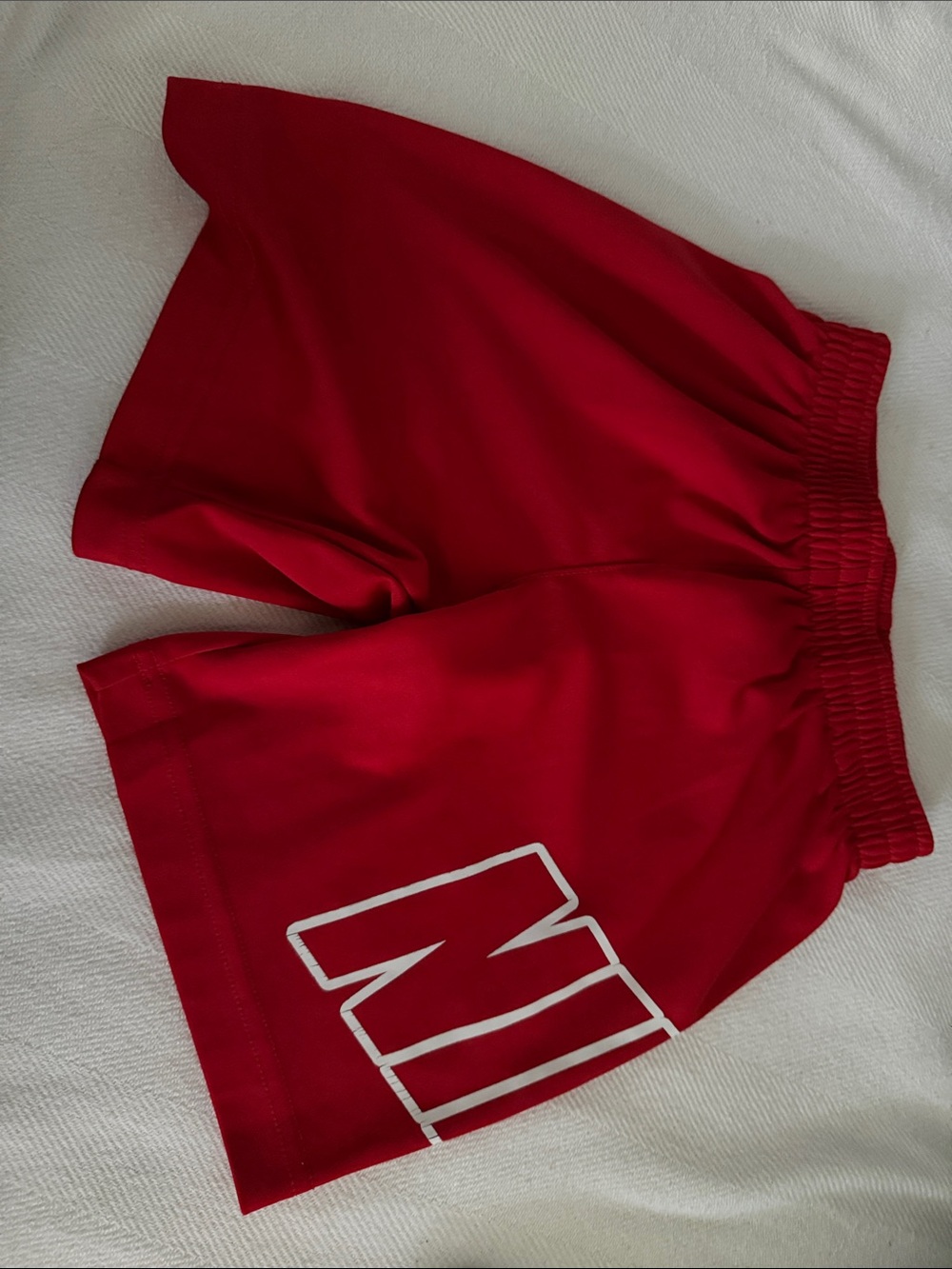 Nike Red Women's Athletic Shorts with White Logo Accent